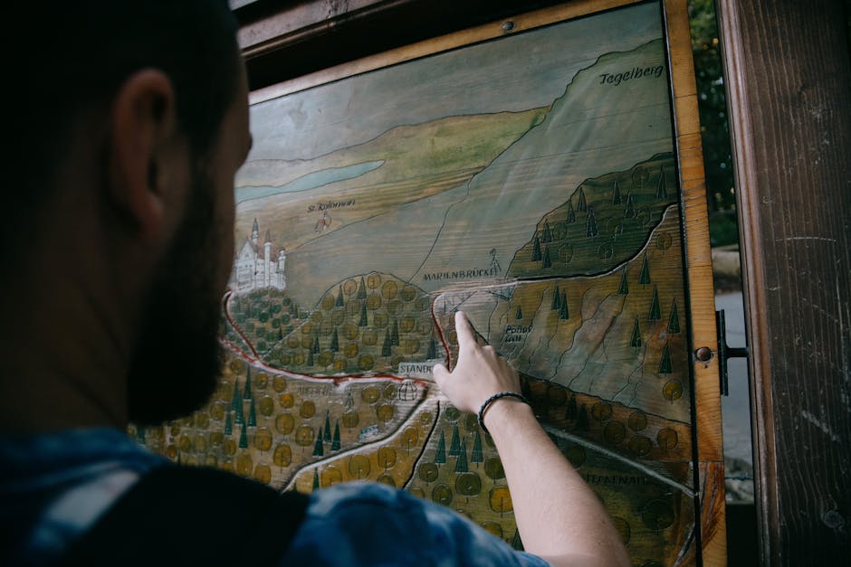 A man explores a wooden map, planning his hiking adventure.